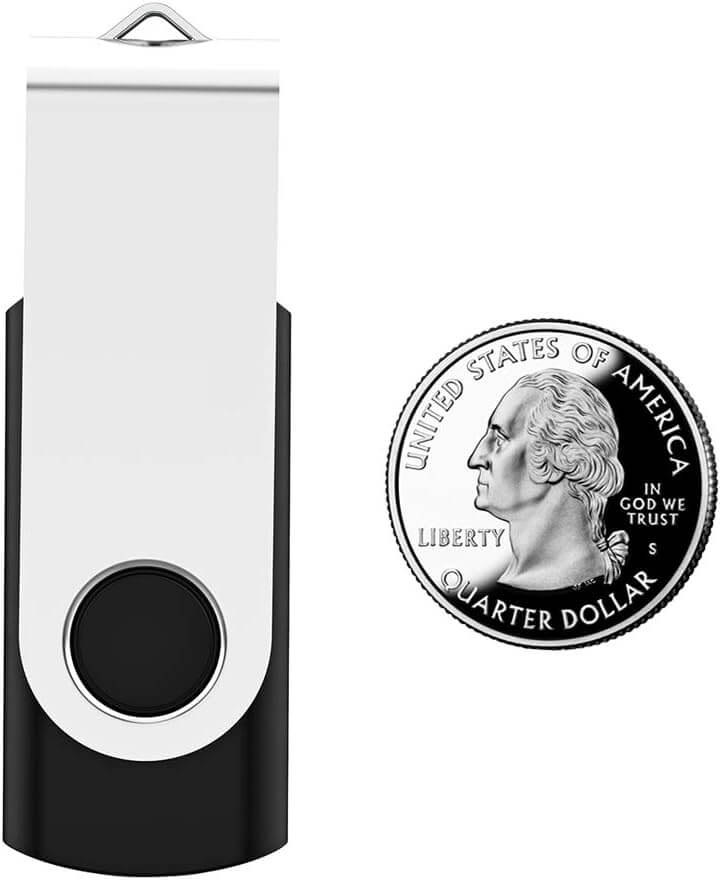 USB Flash Drive 2GB next to a quarter for size comparison, highlighting its compact design.
